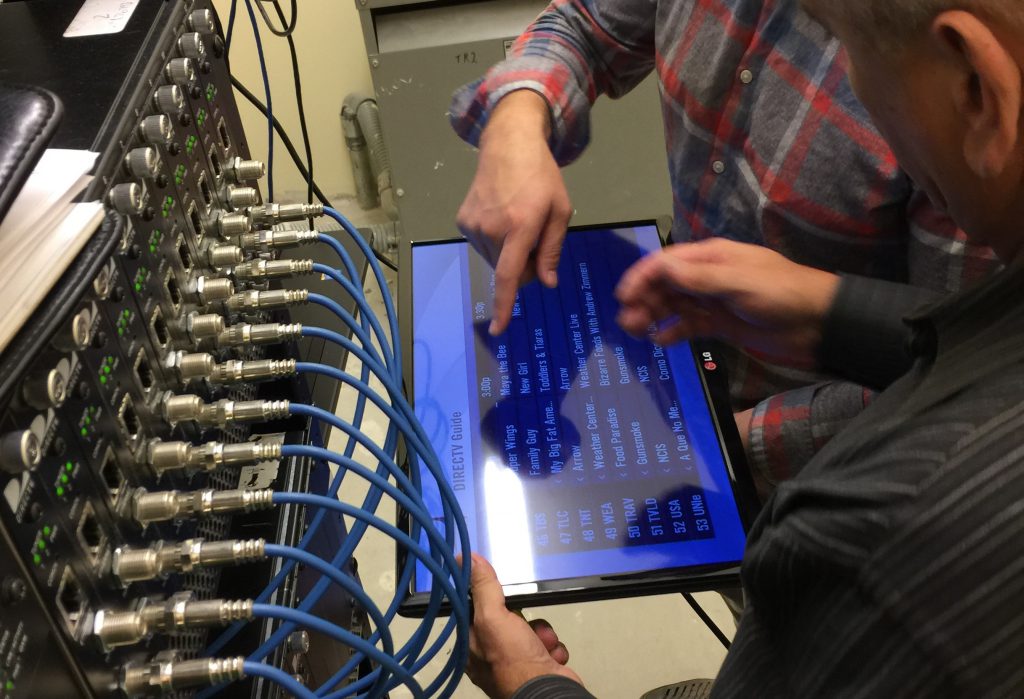 MDM Technicians work on the DirecTV DRE system at Ronald McDonald House Jacksonville. 