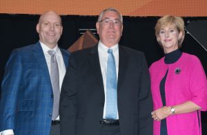 (left to right) Michael J. Alkire, Chief Operating Officer of Premier Inc., Lee Whittaker, MDM President of Healthcare, and Susan DeVore, President and CEO of Premier Inc. celebrate as MDM was honored with the Supplier Legacy Award on June 29, 2017.