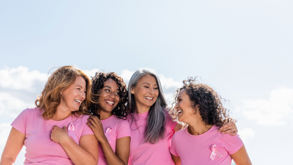 image shows women celebrating breast cancer month