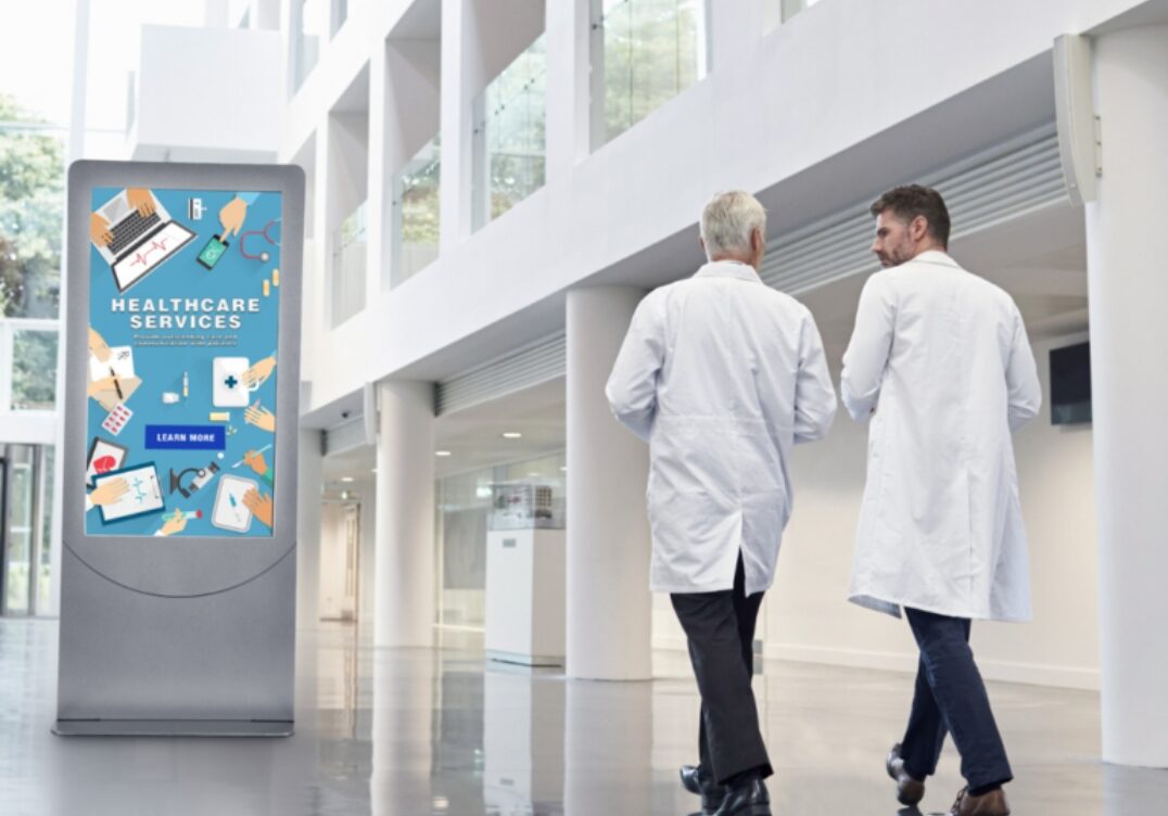 healthcare digital av system Peerless AV hospital kiosk for patient self-check-in and navigation. Great for healthcare av systems