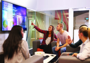 Group Of University Students Discussing Project Together