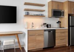 Hotel room featuring coordinated FF&E furniture and décor from national hotel suppliers.